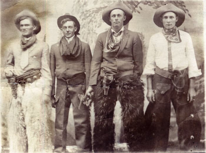 Originally posted to Flickr, this photo of four cowboys was allegedly taken between 1904 and 1918, according to the AZO postcard markings on the back.