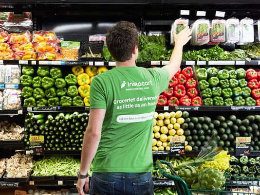 An Instacart shopper picks up the grocery items that are ordered, then delivers them directly to the customer's house.