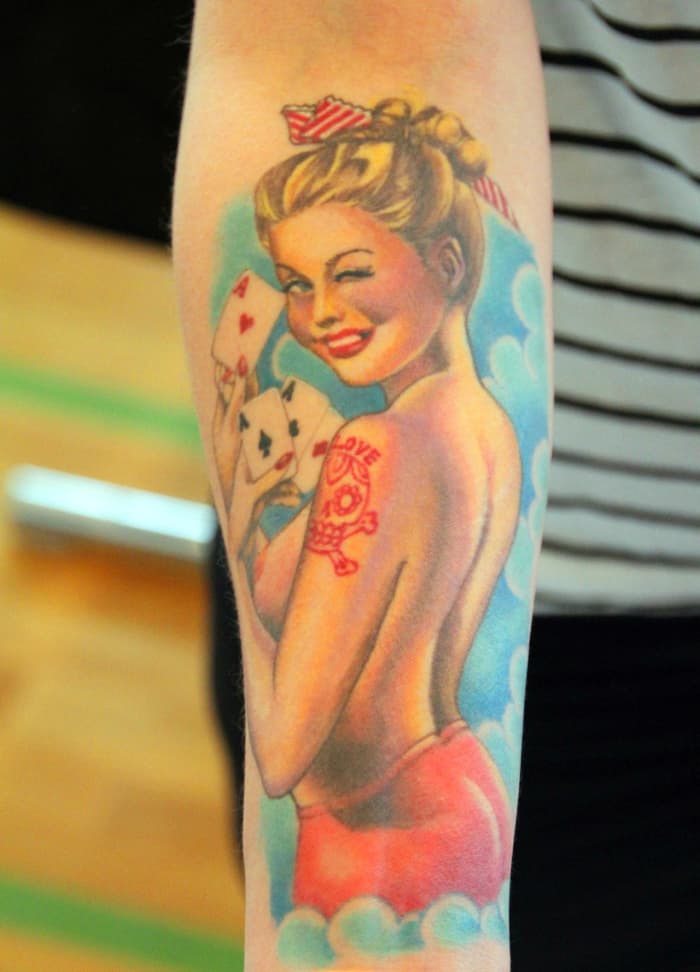Good luck finding an employer that will allow you to wear a half-naked lady tattoo on the back of your arm. It could prompt complaints from coworkers regarding sexual harassment. No joke!