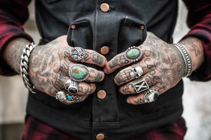 If body art is a part of your lifestyle like it is for this man, then consider searching harder for a tattoo/piercing-friendly companies, occupation, or position. Try smaller employers, creative occupations, and non-customer-facing roles.