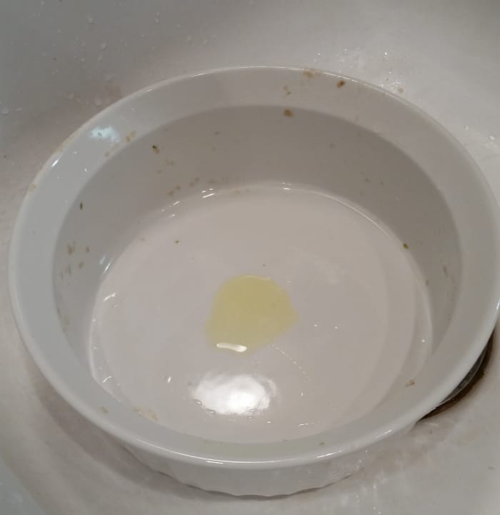 The amount of detergent to use depends on the number of dishes being washed and how greasy they are. You don't want too many suds as that makes it harder to rinse the dishes once they are clean. Next, fill the vessel with hot water.