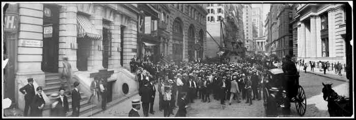 Curb market at Broad Street, in New York City. It later became the American Stock Exchange. In the background, the New York Stock Exchange building can be seen under construction.