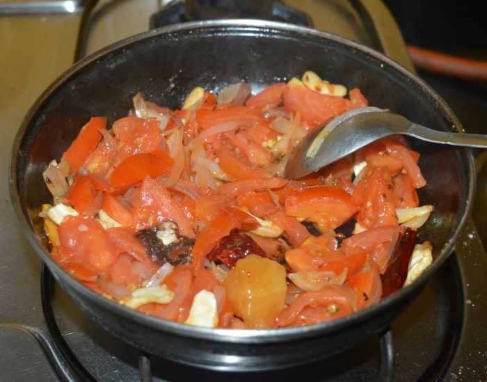 Saute the mixture on medium heat until the tomatoes become a little bit mushy.