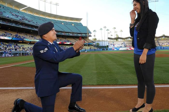 A proposal at a sporting event wont be soon forgotten. Talk to the organization that runs the event to see if they can help make it happen during halftime or other break in the game!