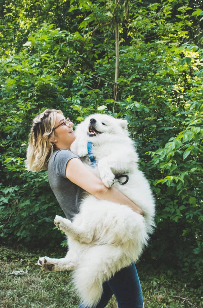 100% she's making him talk out loud about how grateful he feels that she's willing to lug his sweaty fur across the park so he doesn't have to walk another step.