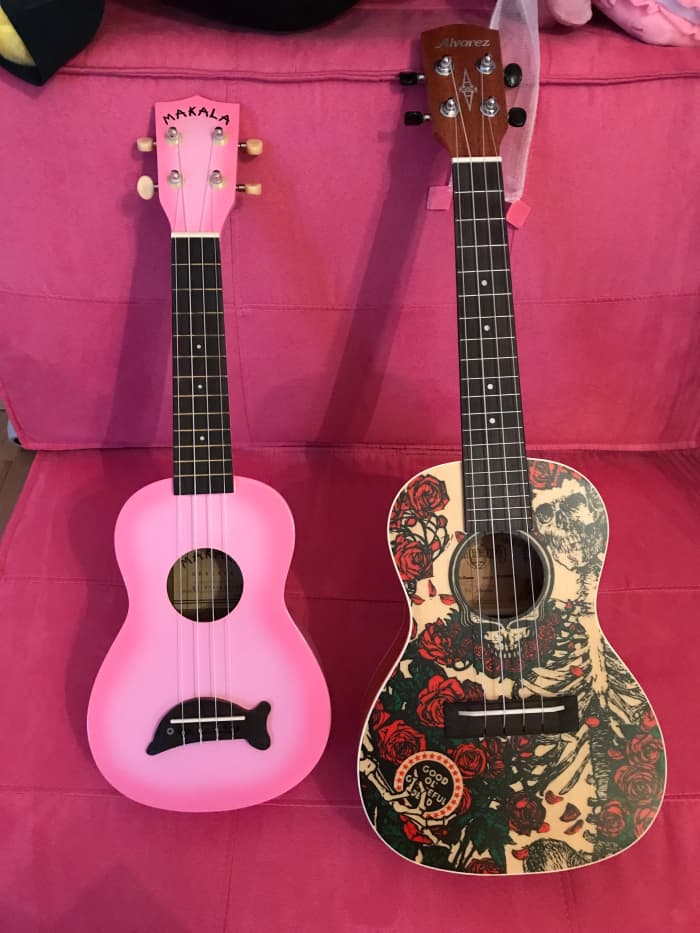 Both of my ukuleles together. Makala Dolphin soprano and Alvarez Grateful Dead concert.
