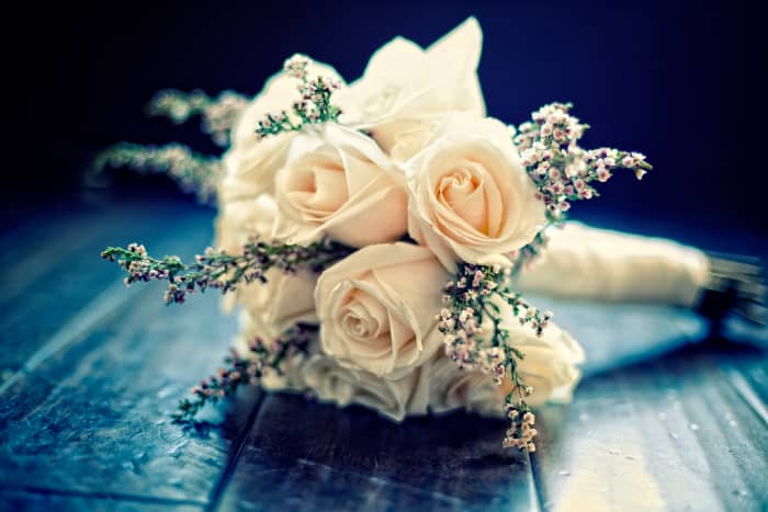 White roses and soft colors are an enduring favorite for wedding bouquets.