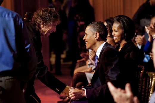 Bob Dylan shakes the hand of President Barack Obama's hand after the "In Performance At The White House: A Celebration Of Music From The Civil Rights Movement" concert in the East Room of the White House, Feb. 9, 2010. (Source: Public Domain Image vi