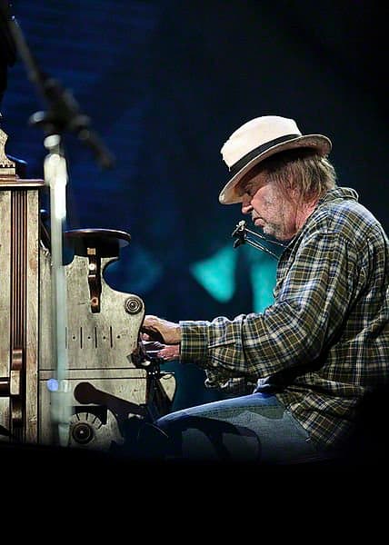 Neil Young performing at Farm Aid on October 2nd, 2010. Over the years Neil Young has quite often wrote and sang about environmental issues.