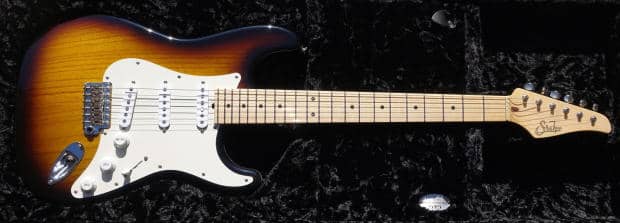 A beautiful Suhr Custom Classic S (not Pro Series) Stratocaster in two tone vintage finish with lightweight swamp ash body weighing on 7.3lbs! The neck is a nice maple with 9"-12" compound radius and soft V profile. The pickups are '54s and give the