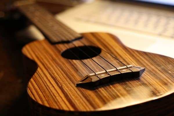 Learning to strum the ukulele takes patience, but when you know how, you can learn how to play lots of simple songs that require basic strumming.