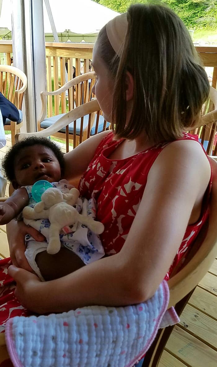 Babies feel most welcomed by the world through nurturing touch. My daughter loved holding her new cousin at a recent family wedding. Weddings are great occasions for family reunions.
