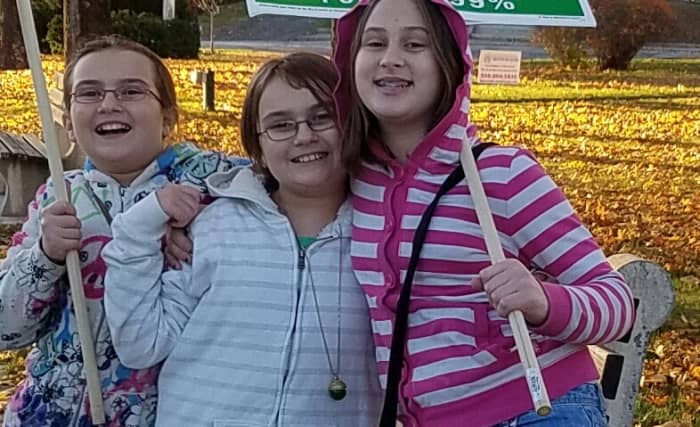 My daugther's best friends helped her hold signs to support the campaign of a neighbor running for local office.