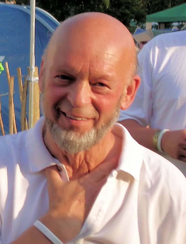 Michael Eavis, dairy farmer, and founder and organiser of Glastonbury Festival, which takes place in the village of Pilton. When the festival is not happening, the land is used for livestock farming.