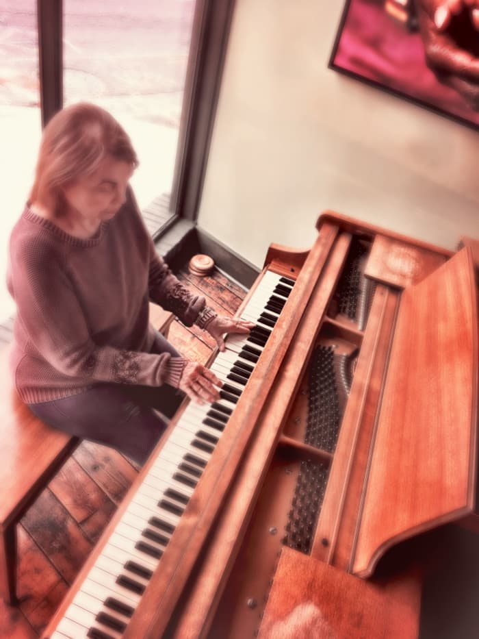 Author, Audrey Hunt, performing on an old baby grand piano. An older piano can still have a beautiful tone if it has been well-cared for.