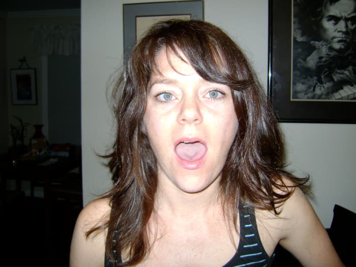 Mouth position for singing "Ah" - tongue must lay flat. Avoid pulling the tongue back or "bunching" - keep it relaxed