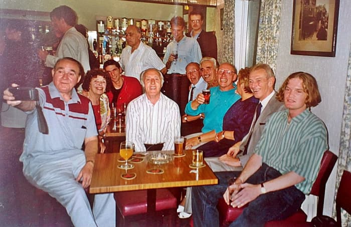 My cousin Jon (right) at my dad's birthday party. Dad is in the turquoise shirt sitting on the right, next to mum. Dad's twin brother, Leonard, is in the centre in the white shirt.