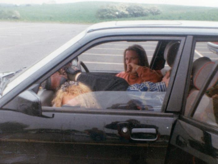 Sitting in my car on the services - Lou in the driving seat, my cousin Jon in the passenger seat and me on the floor.