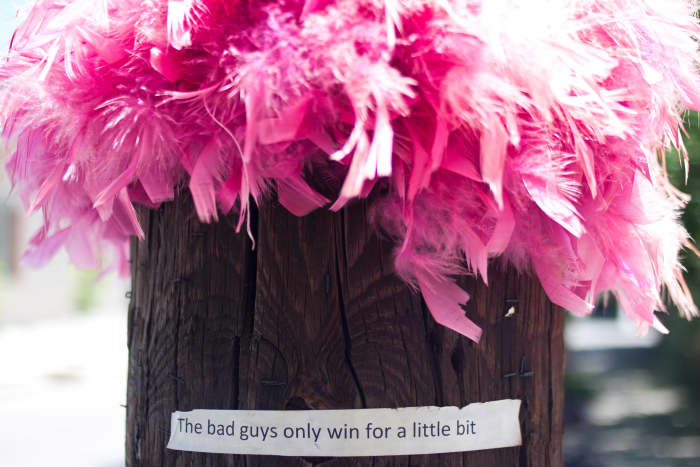 Optimistic lamp post:  "The bad guys only win for a little bit."  