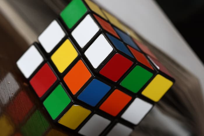 In the early 1980s, the Rubik's cube was a craze. It's a 3x3x3 inch cube puzzle with six colors. Top selling books were written about how to solve the puzzle. Speedcubing competitions also became popular.