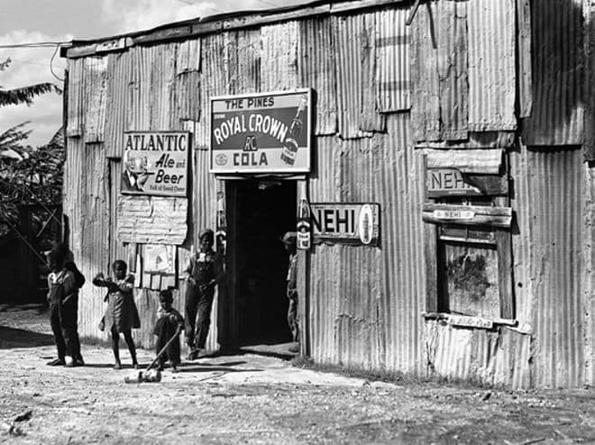 One of Mississippi's Juke Joints. Note the staggering differences economically between the two places. Both spread cultural music around America. The North spread Jazz, the South spread the blues.