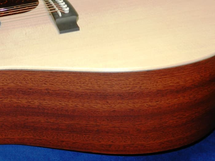 Some guitars, like this Martin, utilize alternative tonewoods and composite materials that cut costs but still look and sound amazing.