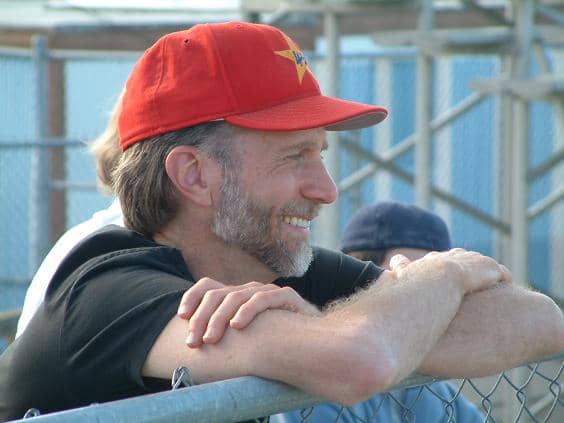 John Luther Adams 1953– (photograph of Adams at a baseball game)