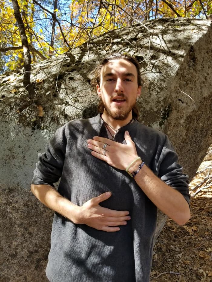 Student, Singer/Actor "Wren" demonstrates how to keep the chest quiet while inflating from the abdomen for proper breath support.