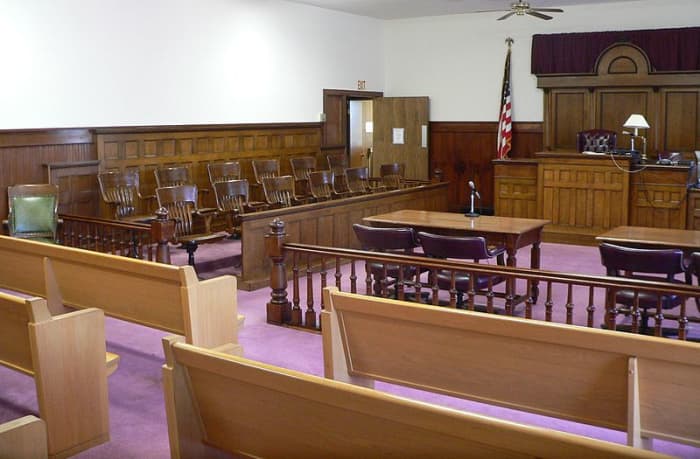 Facing the bench are seats for the public, but sometimes the proceedings are closed for uninvolved parties.