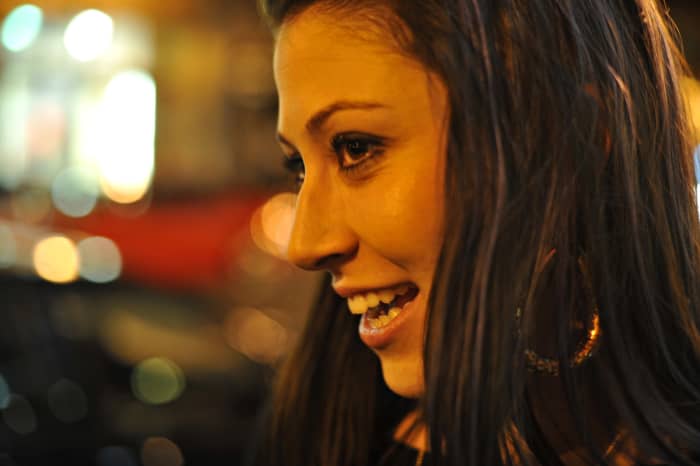 Use eye contact to connect and social touch to express further interest.