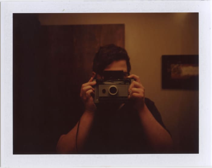 This photo would not be a good option because it doesn't show the person's face. Also, the lighting is very dark.