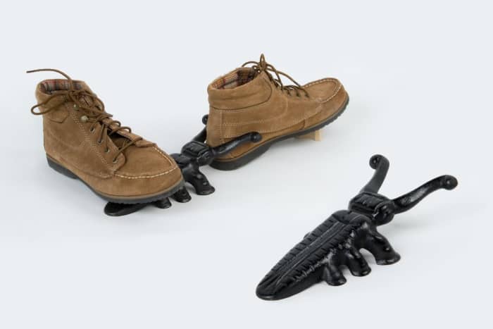 This decorative, cast iron boot jack is much better than the lightweight wooden versions and it will also look nicer outside the door.