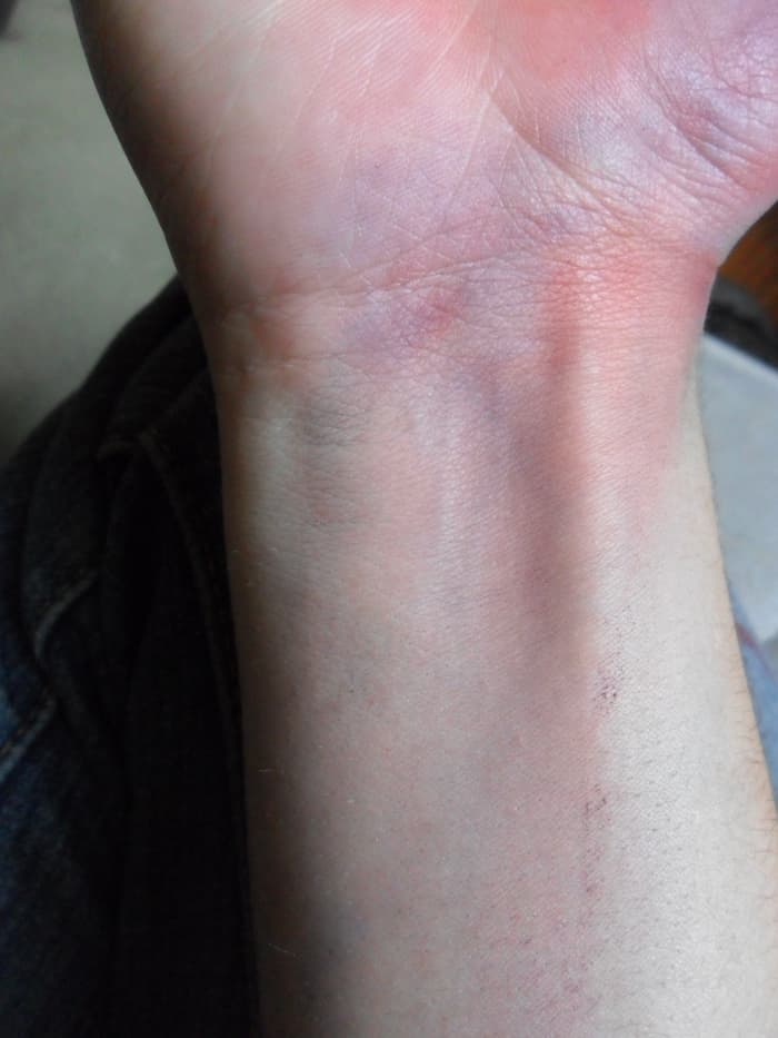 After adding blending some red into my base layer, my wrist now shows a spotty mix of purple, red, and blue.