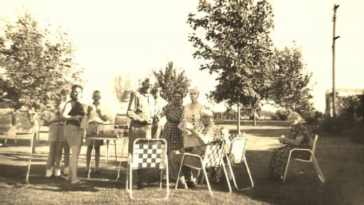 Old family photo of some of our relatives getting ready to enjoy a picnic outdoors.