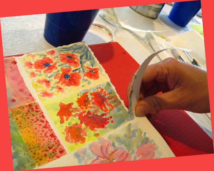 Tearing the edges of your paintings gives them a crafty, organic look that will contrast well with the straight edges of the card.