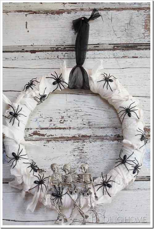 This mummified wreath was done using a muslin type fabric that was torn by hand to get the rough edges. Again, special effects were added using plastic spiders and skeletons.