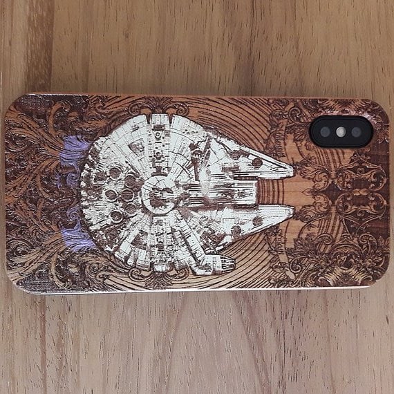 The Engravers Dungeon on Etsy does beautiful work. They have tons of different wood phone covers and they make posters from woodcuts, too.