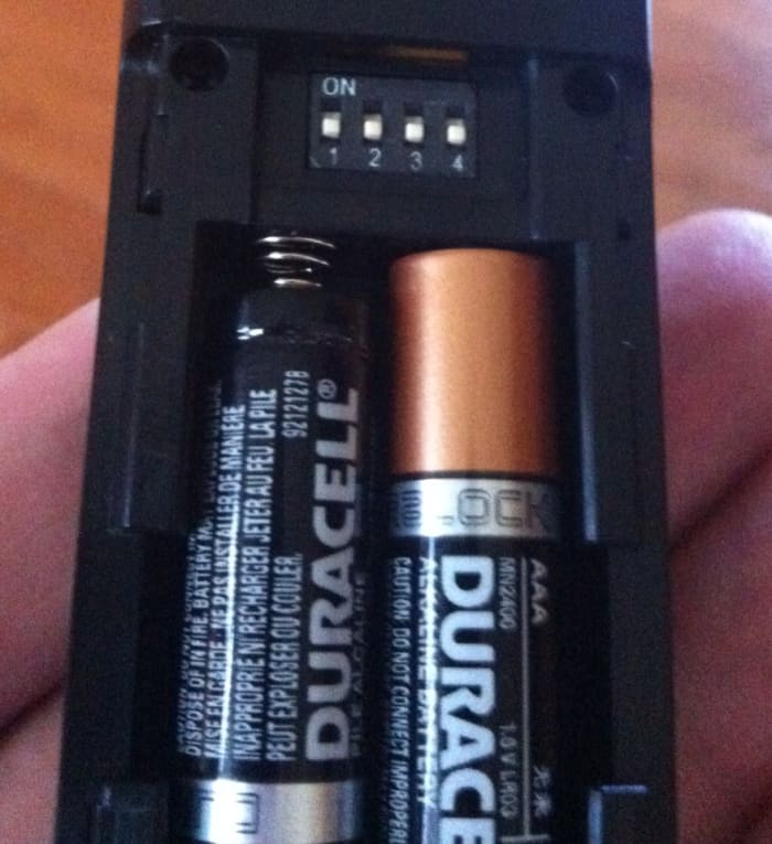 The four white switches on the remote and the receiver must match in order for this to work. It is easy to change them!