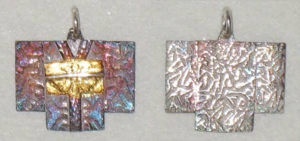 Fine silver kimono charm by Margaret Schindel. Made from PMC metal clay with 24k gold keum-boo on the obi and an iridescent LOS patina, suspended from a sterling silver jump ring.