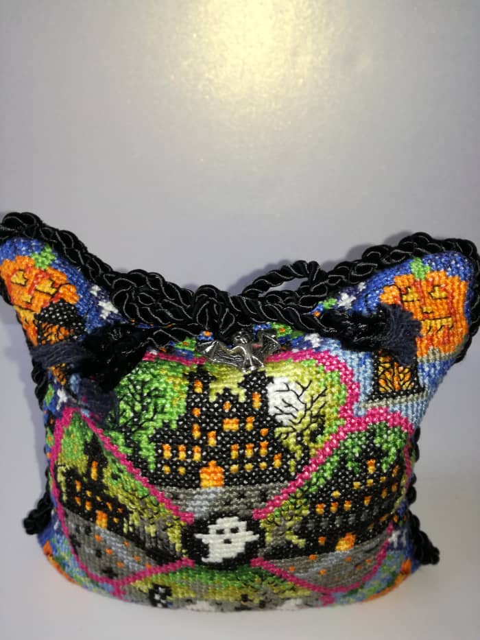 My fully finished object is a piece of Halloween cross stitch I made into a cushion and trimmed with black cord and a silver bat charm.