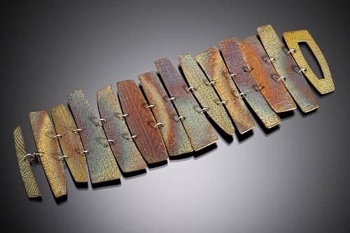 BRONZclay fence bracelet with rainbow patina