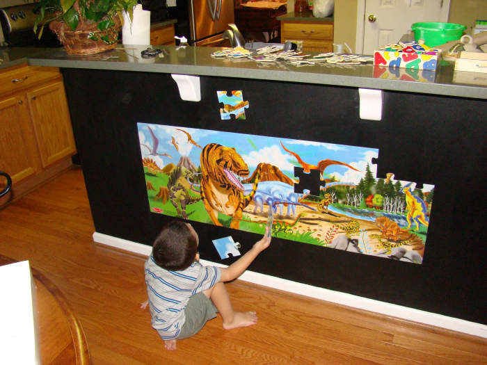 Magnetic puzzles can be slid and centered on the wall when completed, transforming them into instant, interactive wall art. There are a number of gorgeous floor puzzles available, from undersea images to safari animals.