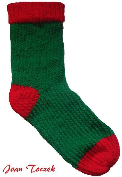 Joan Toczek submitted this photo of the finished Christmas stocking done on the red round Knifty Knitter loom.