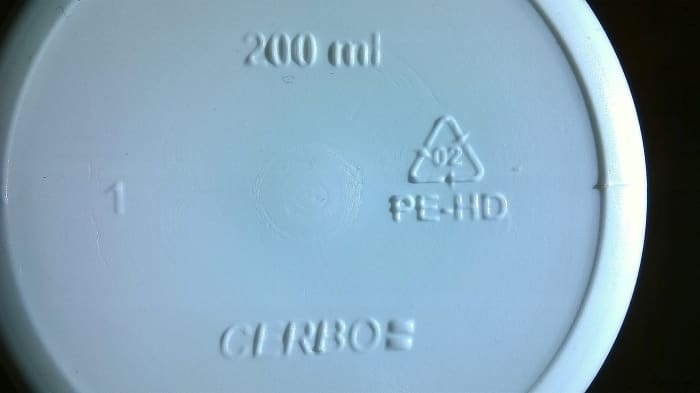 Plastic recycling/identification code embossed onto the underside of a medicine bottle