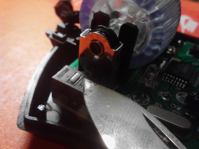 Carefully replace the switch cover. Use care when replacing the small white portion of the button. This is easy to lose. Gently snap the cover evenly back on top of the switch. Trim or adjust the memory foam if you are having trouble.