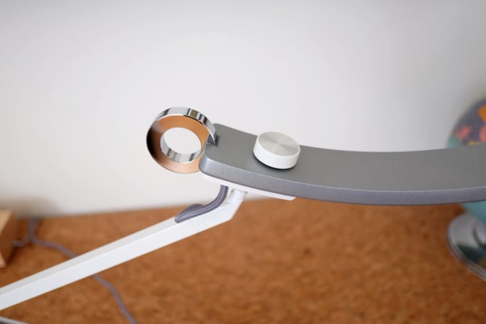 The chromed ring is a touch-activated on-off switch, and also controls the ambient light sensor mode.