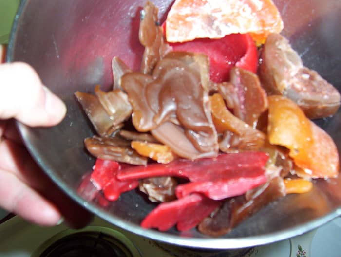 When choosing which leftover wax to mix for your new candle, be sure to select colors and scents that will combine harmoniously. In this case, I used browns, reds, and oranges.