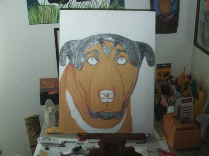 Continue to paint the darker portions of Buster's face.