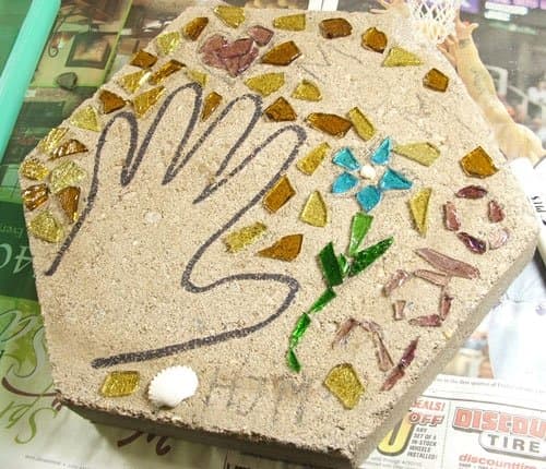 Step 2. Set up your work-space to include plenty of room to place your pre-laid design next to the precast stepping stone. After pouring your mortar slurry you will need to transfer your design pieces quickly before the mortar dries.