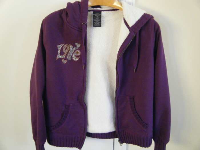 A sweatshirt with added rhinestones.